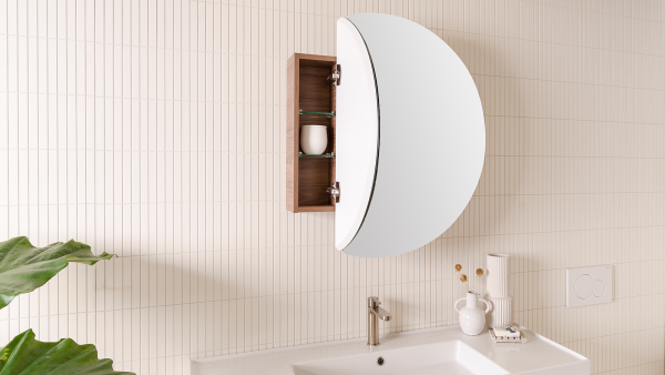 A round, mirrored bathroom cabinet