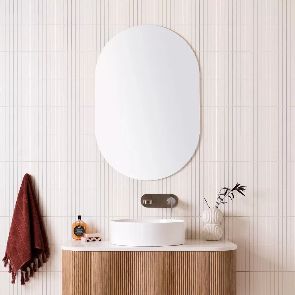 A white oval mirror